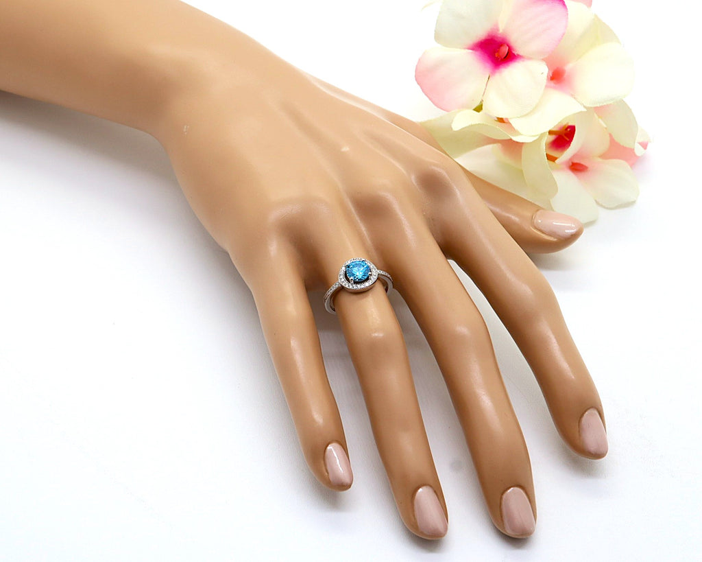 Anillo Plata 925mls Circonita central Azul y circonitas blancas