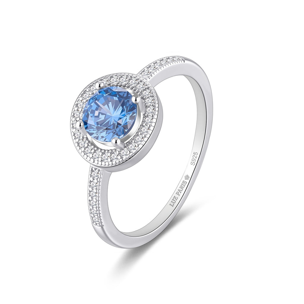 Anillo Plata 925mls Circonita central Azul y circonitas blancas